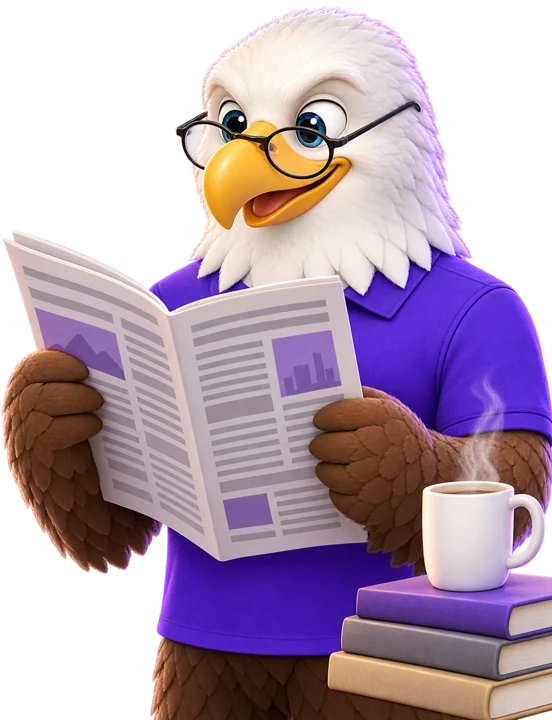 MTI Tech eagle mascot in reading glasses reading a magazine beside a coffee mug